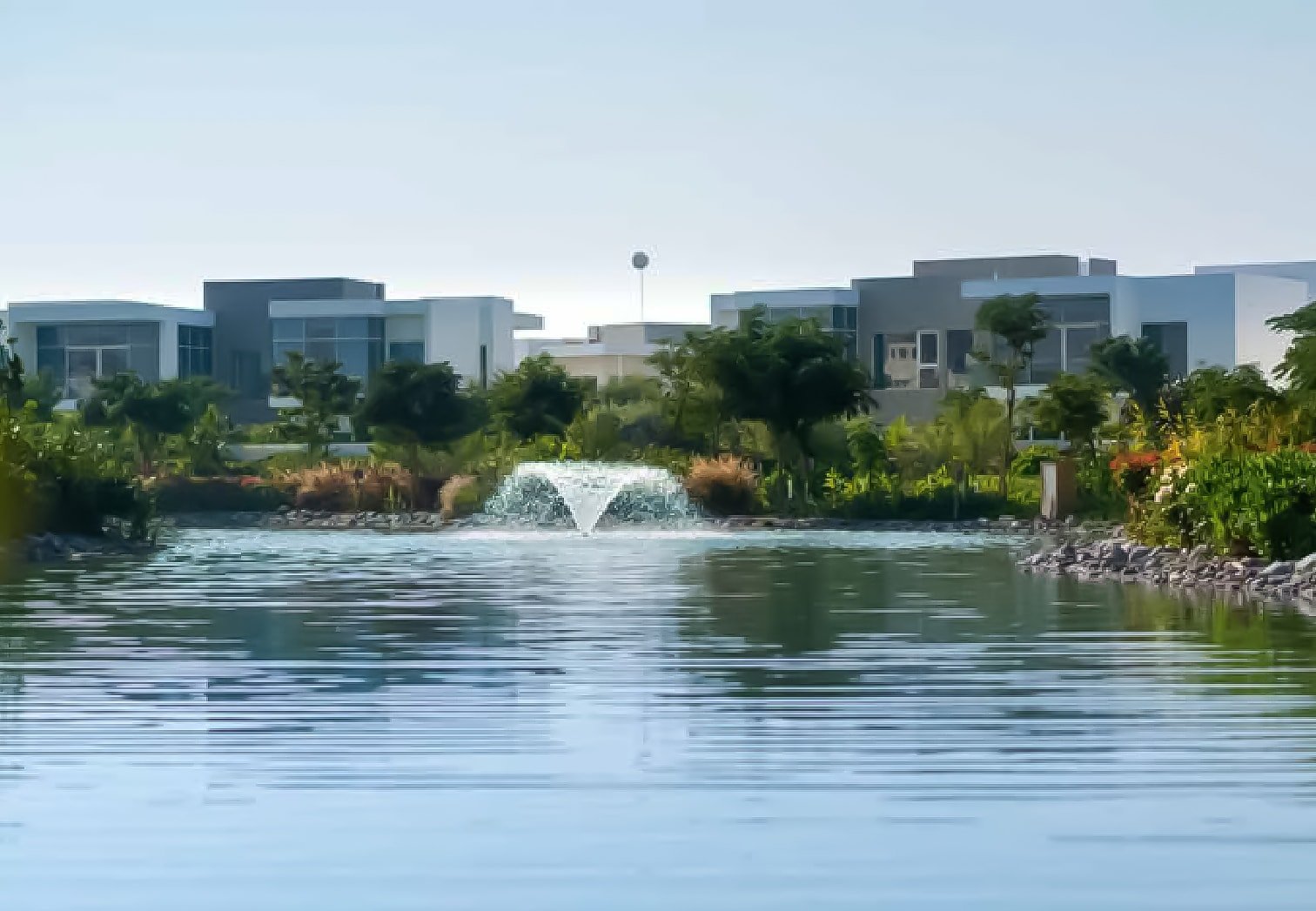 The Nest Al Barari Dubai - An aerial view showcasing the harmonious blend of modern design, green spaces, and private outdoor areas